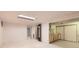 Large basement with white carpet flooring and ample storage space at 912 S Kingston St, Aurora, CO 80012