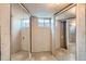 View of basement closet with mirrored sliding doors and tiled floor at 912 S Kingston St, Aurora, CO 80012