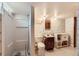 Cozy bathroom with shower, toilet, and sink with mirrored cabinet at 912 S Kingston St, Aurora, CO 80012