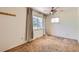 Bedroom with neutral walls, carpet, ceiling fan and large window at 912 S Kingston St, Aurora, CO 80012