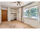 Bedroom featuring a large window, ceiling fan and closet at 912 S Kingston St, Aurora, CO 80012