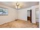 Bedroom with a ceiling fan, large window and access to bathroom at 912 S Kingston St, Aurora, CO 80012