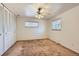Bright bedroom features a ceiling fan, large closet, and natural light at 912 S Kingston St, Aurora, CO 80012