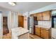Spacious kitchen with wood cabinets, granite countertops, stainless steel appliances, and lots of storage at 912 S Kingston St, Aurora, CO 80012