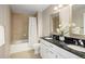 Bathroom featuring granite countertops, double sinks, and a shower over the tub at 1975 N Grant St # 617, Denver, CO 80203
