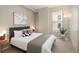 Cozy bedroom with modern decor, a large window, and stylish bedside tables with lamps at 1975 N Grant St # 617, Denver, CO 80203