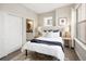 Bright bedroom boasts natural light and features a view of the en suite bathroom at 1975 N Grant St # 617, Denver, CO 80203