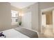 Relaxing bedroom featuring closet, large window and ensuite bathroom with shower over the tub at 1975 N Grant St # 617, Denver, CO 80203