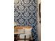 Cozy dining nook features elegant wallpaper and modern chandelier at 1975 N Grant St # 617, Denver, CO 80203