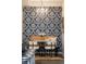 Cozy dining nook features elegant wallpaper and modern chandelier at 1975 N Grant St # 617, Denver, CO 80203