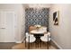 Cozy dining nook features elegant wallpaper and modern chandelier at 1975 N Grant St # 617, Denver, CO 80203