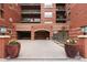 Welcoming entrance to Grant Park with decorative planters and brick accents at 1975 N Grant St # 617, Denver, CO 80203