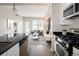 This modern kitchen features stainless steel appliances and opens to the well-lit living area at 1975 N Grant St # 617, Denver, CO 80203