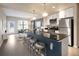 Modern kitchen features a breakfast bar, stainless steel appliances and opens to the cozy living area at 1975 N Grant St # 617, Denver, CO 80203
