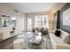 Bright living room boasts modern decor, city views from the window, and hardwood floors at 1975 N Grant St # 617, Denver, CO 80203