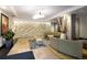 Inviting lobby area features stylish seating, a textured stone wall, and elegant lighting fixtures at 1975 N Grant St # 617, Denver, CO 80203