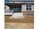 Back exterior with patio, stone accents, and a landscaped yard at 2184 S Gold Bug Ct, Aurora, CO 80018