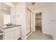 Modern bathroom with a glass-enclosed shower, tile floors, and a single vanity sink at 2184 S Gold Bug Ct, Aurora, CO 80018