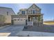 Charming two-story home with stone accents, covered porch, and attached two-car garage at 2184 S Gold Bug Ct, Aurora, CO 80018