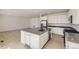 Spacious kitchen featuring stainless steel appliances, white cabinets, and a large center island at 2184 S Gold Bug Ct, Aurora, CO 80018