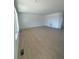 Open concept living room with wood-look flooring and plenty of natural light at 2184 S Gold Bug Ct, Aurora, CO 80018