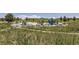 Community playground featuring climbing structures, slides, and shaded picnic areas in a natural setting at 2184 S Gold Bug Ct, Aurora, CO 80018