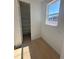 Hallway with window and a large shelved storage area at 2184 S Gold Bug Ct, Aurora, CO 80018