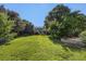 Large backyard with well-maintained lawn and mature trees, perfect for outdoor activities at 5405 Military Trl, Parker, CO 80134
