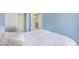 Cozy bedroom with blue walls, closet and view of the stairs and a door to another room at 5405 Military Trl, Parker, CO 80134