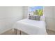 Cozy bedroom with a large window offering natural light and neutral decor at 5405 Military Trl, Parker, CO 80134