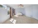 Spacious main bedroom with carpet and large windows providing natural light at 5405 Military Trl, Parker, CO 80134