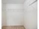 This is a walk-in closet with carpeted floor and white walls and shelving at 5405 Military Trl, Parker, CO 80134
