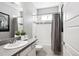 Well-lit bathroom featuring a shower-tub combo with a modern vanity at 1173 Basalt Ridge Loop, Castle Rock, CO 80108