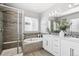 Bright bathroom showcasing a soaking tub, walk-in shower, and double sink vanity at 1173 Basalt Ridge Loop, Castle Rock, CO 80108
