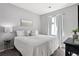 Cozy bedroom featuring a queen-sized bed, neutral decor, and plenty of natural light at 1173 Basalt Ridge Loop, Castle Rock, CO 80108