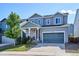 Charming two-story home featuring a well-maintained lawn and a two-car garage at 1173 Basalt Ridge Loop, Castle Rock, CO 80108