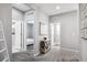 Light and bright hallway with views into bedrooms and bathrooms at 1173 Basalt Ridge Loop, Castle Rock, CO 80108