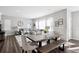 Spacious living area featuring a sofa, dining table, and large windows for natural light at 1173 Basalt Ridge Loop, Castle Rock, CO 80108