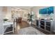 Inviting dining room with wood floors, a pendant light, and a view into the living space at 8114 Briar Ridge Dr, Castle Pines, CO 80108