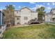 A charming home with neutral siding, a backyard, and a wooden deck at 8114 Briar Ridge Dr, Castle Pines, CO 80108