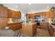 Spacious kitchen featuring wood cabinets, stainless steel appliances, and a center island at 8114 Briar Ridge Dr, Castle Pines, CO 80108