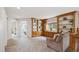 Cozy living room with built-in bookshelves, a window seat, and comfortable seating at 8114 Briar Ridge Dr, Castle Pines, CO 80108