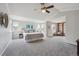 Spacious primary bedroom with vaulted ceiling, ample natural light, and sitting area at 8114 Briar Ridge Dr, Castle Pines, CO 80108