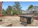 Beautiful backyard featuring a large patio, hot tub, and mature trees at 5784 W 81St Cir, Arvada, CO 80003