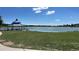 Lake with Gazebo on shore. Large body of water surrounded by park and foliage at 5784 W 81St Cir, Arvada, CO 80003