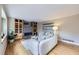 Inviting living room featuring a fireplace, built-in shelves, wood flooring and a comfortable sofa at 5784 W 81St Cir, Arvada, CO 80003