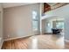 Spacious living room with high ceilings, hardwood floors, lots of natural light and dining area at 5784 W 81St Cir, Arvada, CO 80003