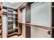 Walk-in closet with shelving and hanging rods, perfect for organization and storage at 5784 W 81St Cir, Arvada, CO 80003