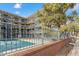 Inviting three-story apartment complex with secure courtyard featuring a refreshing community pool for resident enjoyment at 33 N Corona St # 401, Denver, CO 80218