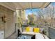 Relaxing balcony features stylish outdoor seating with city views and decorative pillows, perfect for outdoor enjoyment at 33 N Corona St # 401, Denver, CO 80218
